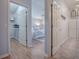 Hallway view leading to main bedroom with closet and bath at 591 Statesburg St, The Villages, FL 32162
