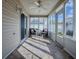 Enclosed sunroom with lots of windows, ceiling fan, and stylish furniture at 591 Statesburg St, The Villages, FL 32162