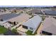 This aerial showcases a neatly kept property with a screened patio and verdant lawn, enclosed by a crisp white fence at 5934 Kaplan Ct, The Villages, FL 32163