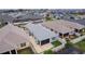 Aerial view of a single-Gathering home featuring a screened-in lanai, fenced yard, and mature landscaping in a well-maintained neighborhood at 5934 Kaplan Ct, The Villages, FL 32163