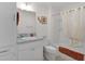 This bathroom has a sink, mirror, bath tub with shower and light fixture at 5934 Kaplan Ct, The Villages, FL 32163