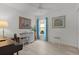 Bright bedroom/office with a white desk, soft natural light, and a music instrument at 5934 Kaplan Ct, The Villages, FL 32163