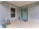 Charming front porch with a bright front door, decorative wreath, and pleasant decor at 5934 Kaplan Ct, The Villages, FL 32163