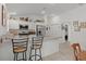 Modern kitchen featuring stainless steel appliances and a breakfast bar with seating at 5934 Kaplan Ct, The Villages, FL 32163