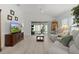 Bright living room featuring sliding glass doors, neutral walls, and modern flooring at 5934 Kaplan Ct, The Villages, FL 32163