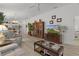 Bright living room with open floor plan, neutral colors, and seamless flow to the kitchen at 5934 Kaplan Ct, The Villages, FL 32163