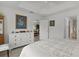 Bright bedroom with walk-in closet, ceiling fan, and doorway to the bathroom at 5934 Kaplan Ct, The Villages, FL 32163