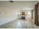 Cozy living room featuring a decorative fireplace, neutral paint, tile floors and natural light at 618 N Grandview St, Mount Dora, FL 32757