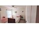 Well-lit bedroom with carpet flooring, closet, and a ceiling fan at 7133 Sw 135Th Pl, Ocala, FL 34473