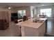 Open concept kitchen with an island overlooking the living and dining areas; great for entertaining at 7133 Sw 135Th Pl, Ocala, FL 34473