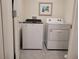 Convenient laundry room with a modern washer and dryer, providing ease for laundry tasks at 7133 Sw 135Th Pl, Ocala, FL 34473