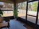 Relaxing screened patio area with a view of the backyard, offering a perfect space for outdoor enjoyment at 7133 Sw 135Th Pl, Ocala, FL 34473