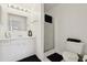Clean bathroom featuring a vanity with storage, mirror, a glass-enclosed shower, and a toilet at 731 Hernandez Dr, The Villages, FL 32159
