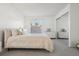 Bright bedroom featuring a plush bed, neutral décor, and a closet with mirrored doors at 731 Hernandez Dr, The Villages, FL 32159