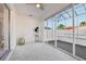 Bright sunroom with sliding glass doors, carpeted floor, and ample natural light at 731 Hernandez Dr, The Villages, FL 32159