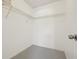 Walk-in closet providing ample storage space with installed shelving and neutral carpeting at 731 Hernandez Dr, The Villages, FL 32159