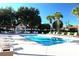Inviting community pool area with comfortable seating and shaded pergola at 731 Hernandez Dr, The Villages, FL 32159