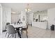 Bright dining space with a modern table, contemporary chairs, and stylish light fixture at 731 Hernandez Dr, The Villages, FL 32159