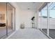 Bright sunroom with neutral carpeting, a plant accent, and sliding glass doors to the outside at 731 Hernandez Dr, The Villages, FL 32159