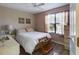 Bright bedroom featuring a ceiling fan, window with natural light, and neutral decor at 737 Bolivar St, The Villages, FL 32159