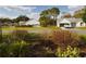 Street view of neighborhood homes with green lawns and mature trees at 737 Bolivar St, The Villages, FL 32159