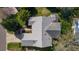 Aerial view of the home featuring a well-maintained roof and screened lanai at 8104 Se 177Th Winterthur Loop, The Villages, FL 32162