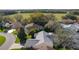 Aerial view of a home in a community, backing up to a large green field at 8104 Se 177Th Winterthur Loop, The Villages, FL 32162