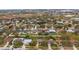 Aerial view of a residential neighborhood with well-maintained homes and yards at 822 Princeton Dr, Clermont, FL 34711