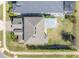 Aerial view of a beautiful house with an expansive roof and well-maintained landscaping at 831 Zeek Ridge Ct, Clermont, FL 34715