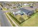 Aerial view of a home with a large backyard, featuring a patio and fenced perimeter at 831 Zeek Ridge Ct, Clermont, FL 34715