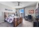 Bright bedroom featuring a baseball themed bed, ceiling fan, and a work desk area at 831 Zeek Ridge Ct, Clermont, FL 34715