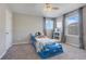 Bedroom featuring a car shaped bed, closet, multiple windows, and carpet flooring at 831 Zeek Ridge Ct, Clermont, FL 34715