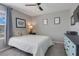 Bedroom featuring a patterned bed, modern decorations, and a window with natural light at 831 Zeek Ridge Ct, Clermont, FL 34715