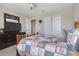Nicely decorated bedroom featuring a bed, television, ceiling fan, and closet at 831 Zeek Ridge Ct, Clermont, FL 34715
