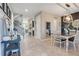 Open dining area with elegant light fixture and decor at 831 Zeek Ridge Ct, Clermont, FL 34715