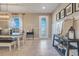 Dining room featuring pendant lighting fixture and adjacent kitchen and doorway at 831 Zeek Ridge Ct, Clermont, FL 34715