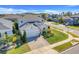 Desirable two-story home featuring lush landscaping, a brick driveway, and an attached two-car garage at 831 Zeek Ridge Ct, Clermont, FL 34715