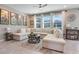 Inviting living room featuring a large sectional sofa, area rug, and ample natural light at 831 Zeek Ridge Ct, Clermont, FL 34715