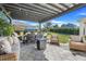 Wide patio featuring a textured floor, outdoor seating, a pergola and backyard views at 831 Zeek Ridge Ct, Clermont, FL 34715