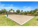 An outdoor community sand volleyball court invites friendly competition and active recreation among neighbors at 831 Zeek Ridge Ct, Clermont, FL 34715