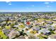 Charming residential area showcasing cozy homes with manicured lawns and mature trees at 909 Abaco Path, The Villages, FL 32163