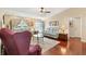Inviting living room featuring hardwood floors and neutral walls, creating a warm and welcoming atmosphere at 909 Abaco Path, The Villages, FL 32163