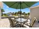 Inviting outdoor patio area with comfortable seating, perfect for relaxing or entertaining guests at 909 Abaco Path, The Villages, FL 32163