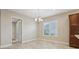 Bright dining area featuring a chandelier and natural light from the window at 960 Pickering Path, The Villages, FL 32163