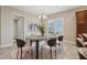 Elegant dining room with a modern table, chairs, and chandelier at 960 Pickering Path, The Villages, FL 32163