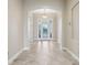Bright foyer features tile floors and a decorative front door with sidelights at 960 Pickering Path, The Villages, FL 32163