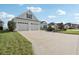 This charming one-story home features a well-manicured lawn, beautiful landscaping, and a two-car garage at 960 Pickering Path, The Villages, FL 32163