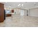 Open living space featuring tile flooring, breakfast bar, and easy access to the kitchen at 960 Pickering Path, The Villages, FL 32163