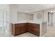 Elegant living room with hardwood cabinets, granite countertops, and an open layout for entertaining at 960 Pickering Path, The Villages, FL 32163