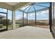 Spacious screened-in patio perfect for enjoying outdoor living, with views of the backyard at 960 Pickering Path, The Villages, FL 32163